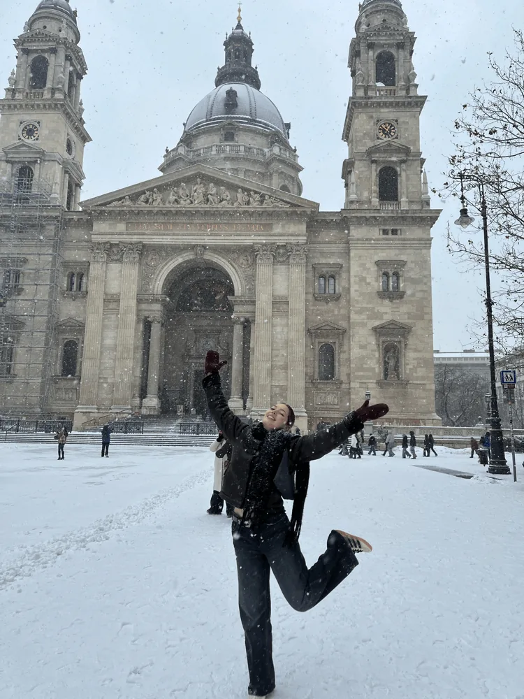 Fiona jumping in the snow in front of St. Stephen’s Basilica in Budapest
